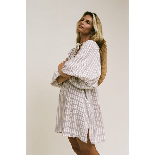 model wearing DAUGHTERS OF INDIA Poet Mini Dress ~ Vanilla
