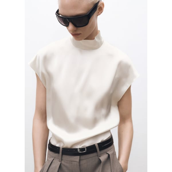 model wearing high beck blouse