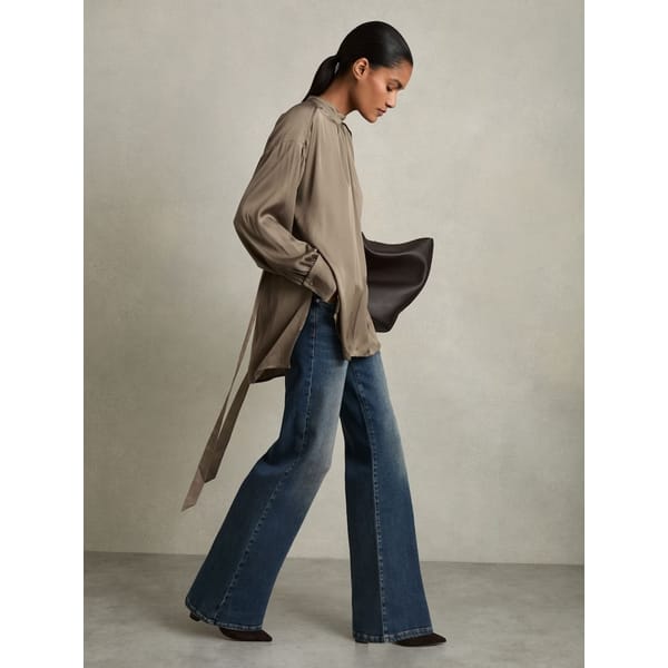 model wearing REISS Lina Woven High-Neck Belted Blouse in Mink £138