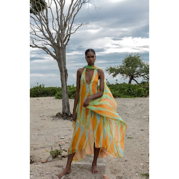 model on beach wearing Anna Redman Pablo 'Canica' Dress
