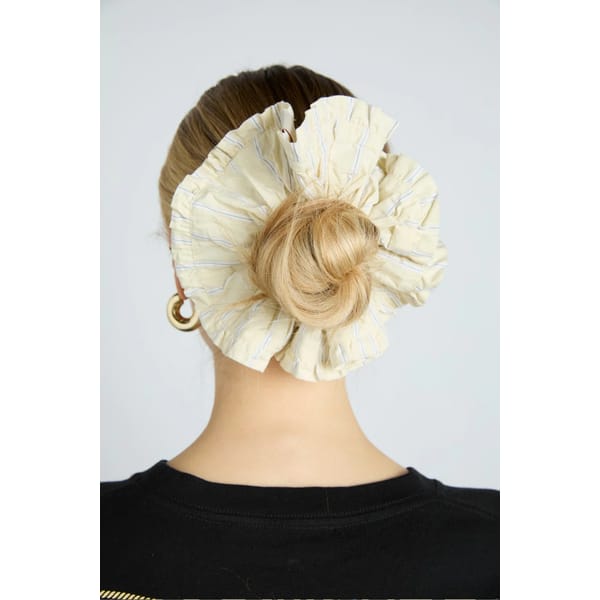model from back wearing butter yellow scrunchie