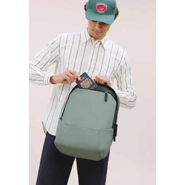 male model with green backpack