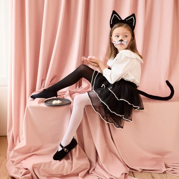 little girl wearing Meri Meri Cat Costume
