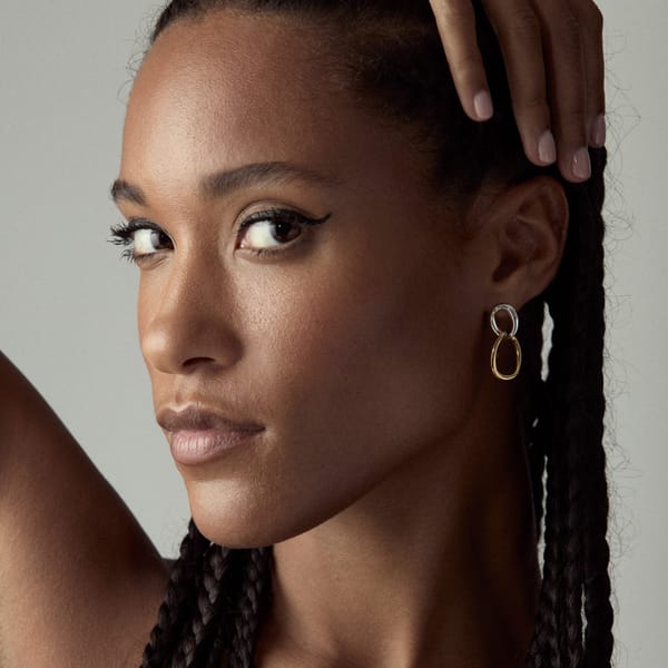 model wearing wave earrings