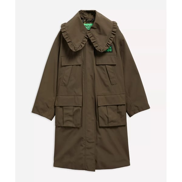 A long, brown coat with a large ruffled collar, four front flap pockets, and a green tag on the chest. Inspired by stylish waterproof jackets, this coat features a relaxed fit and extended sleeves for added comfort.