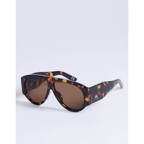 Oversized sunglasses with a brown tortoiseshell frame and large, rounded brown lenses, displayed on a plain white background.