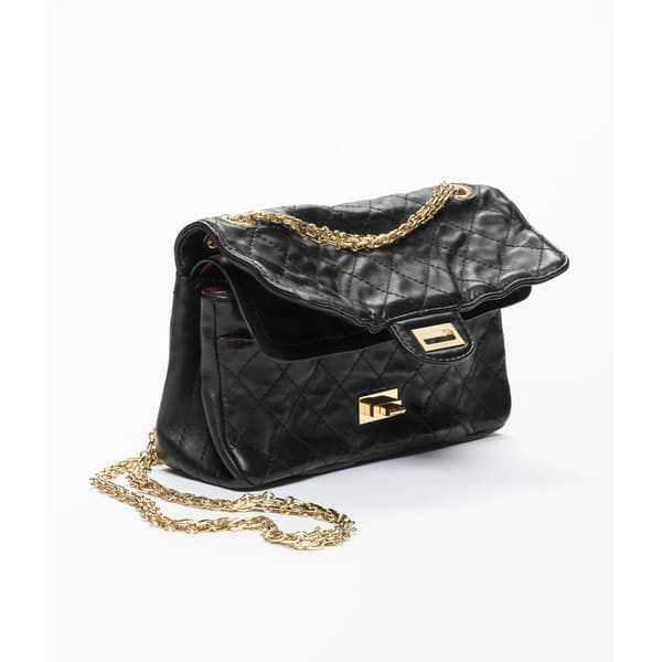 A black quilted leather handbag with a gold chain strap and gold clasp, set against a white background. The flap of the high-end designer bag is open, revealing a glimpse of the interior—a detail any fashion editor would admire.