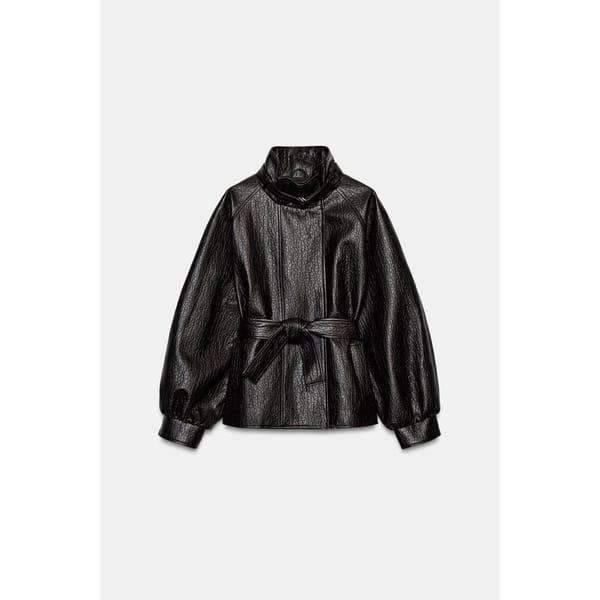 Black belted jacket with a high collar and long sleeves, one of the best women’s leather jackets.