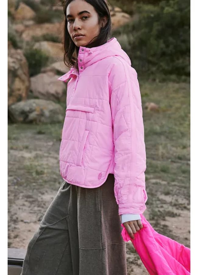 model wears pink puffer
