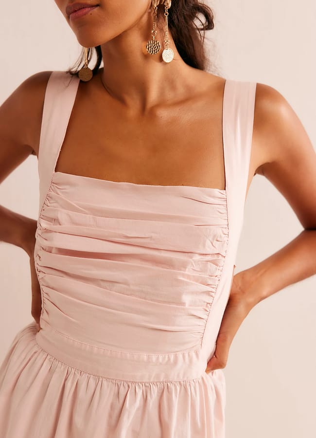 close up of pink ruched corset dress