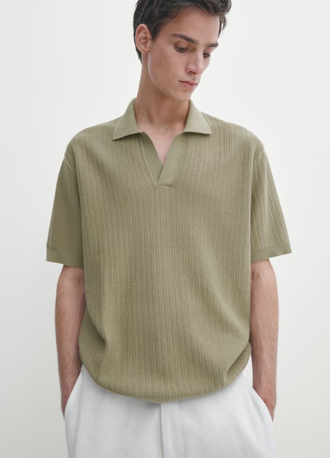 male model wearing green KNIT POLO SHIRT WITH FABRIC DETAIL