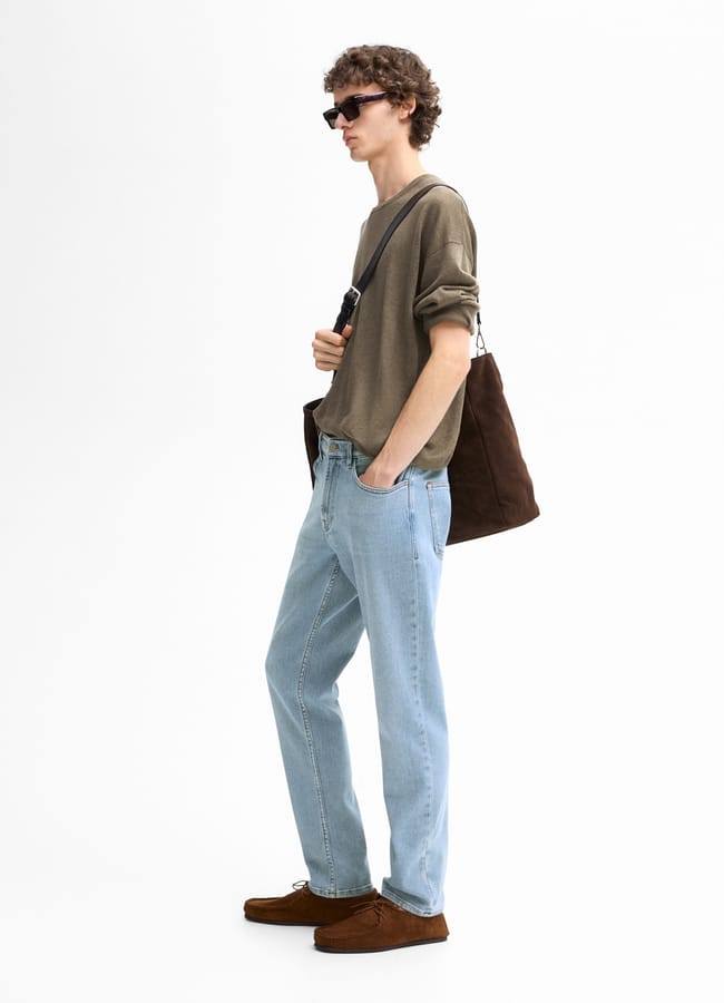 male model wearing denim Tapered Fit Trousers