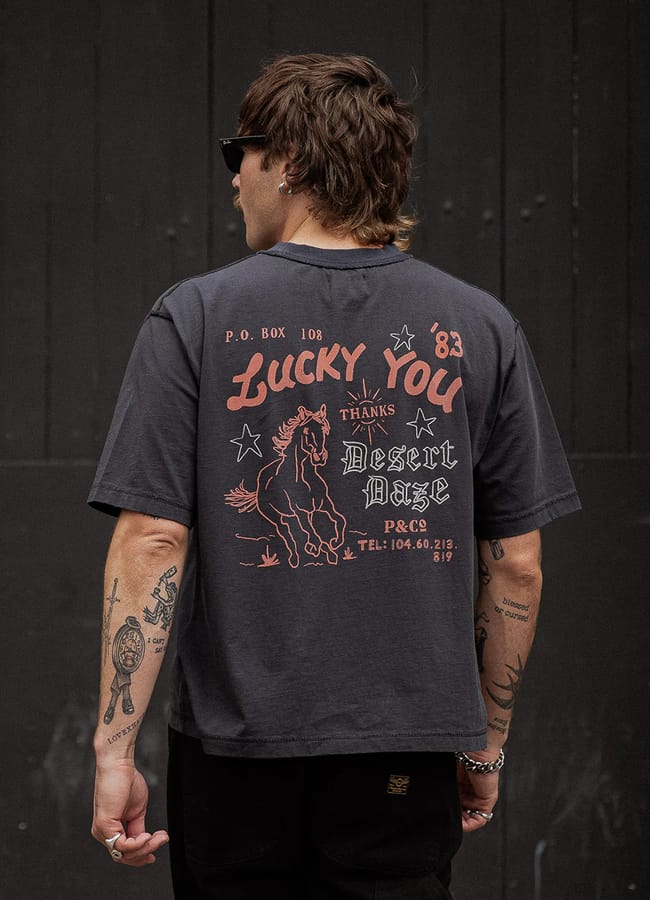 male model from back wearing P & Co Desert Daze Boxy T-Shirt - Heavy Washed Black