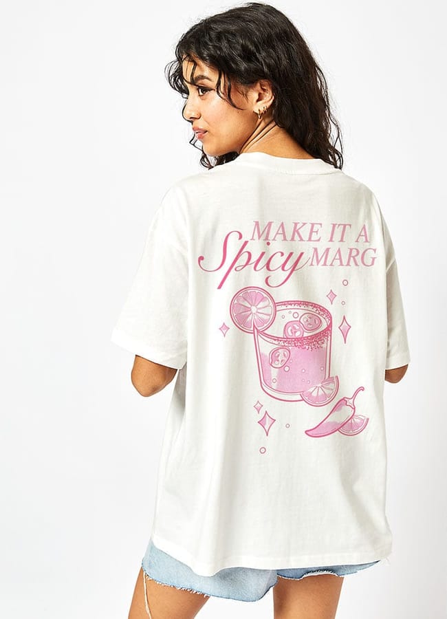 model from back wearing slogan SKINNYDIP Spicy Margs T-Shirt in Ecru