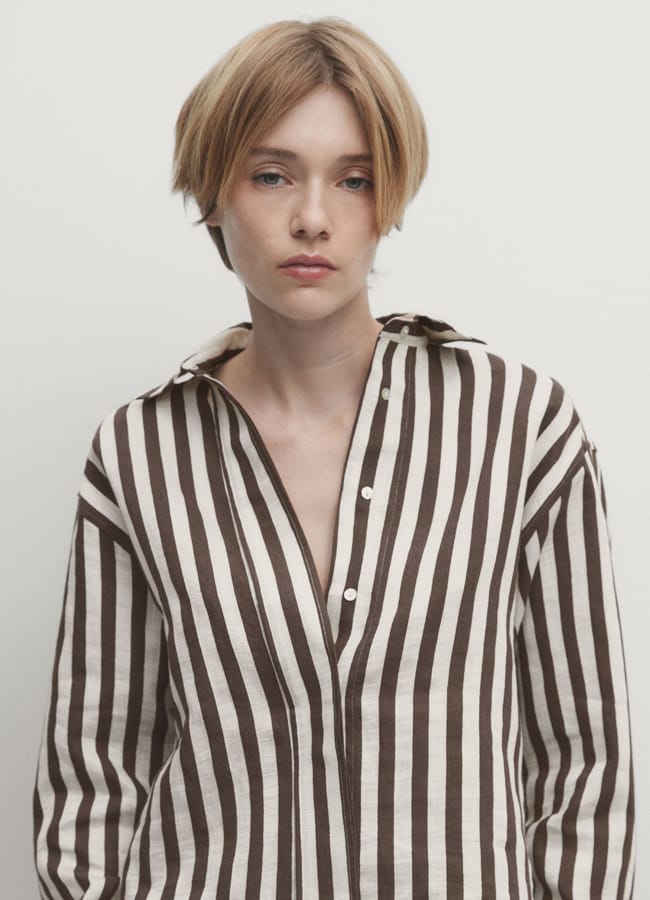 model wears brown and white MASSIMO DUTTI Striped cropped linen blend shirt with long sleeves