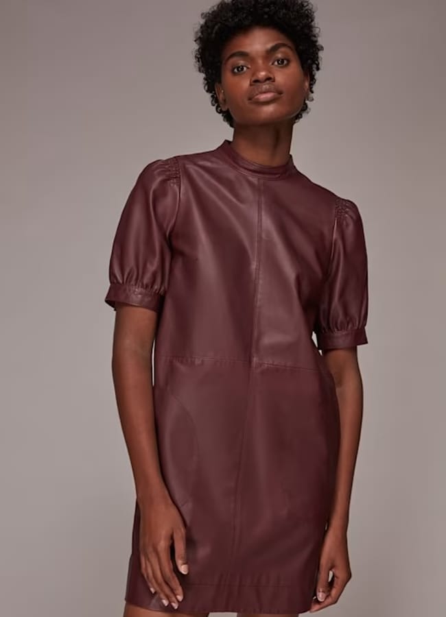model wears burgundy leather puff sleeve dress