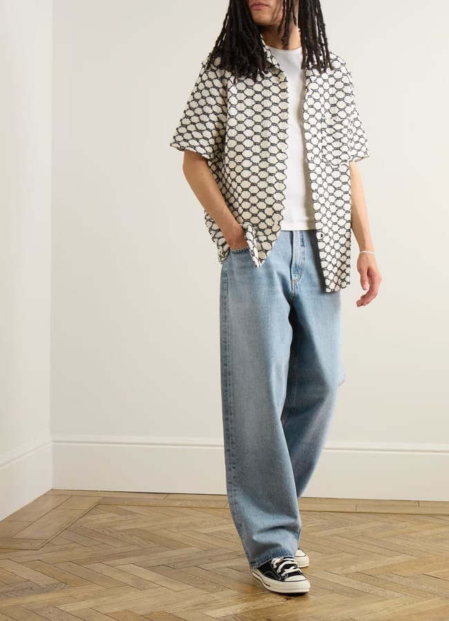 male model wearing AGOLDE Fusion Straight-Leg Frayed Jeans