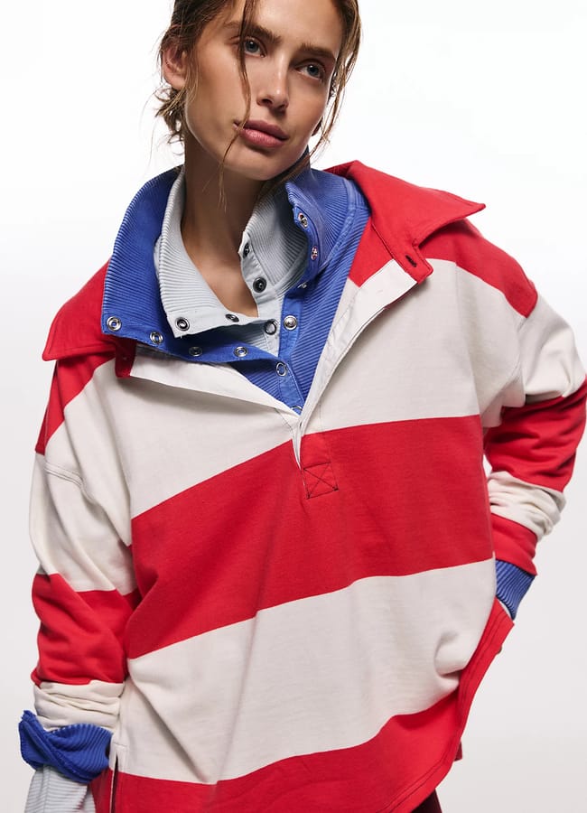 model wearing layered rugby shirts