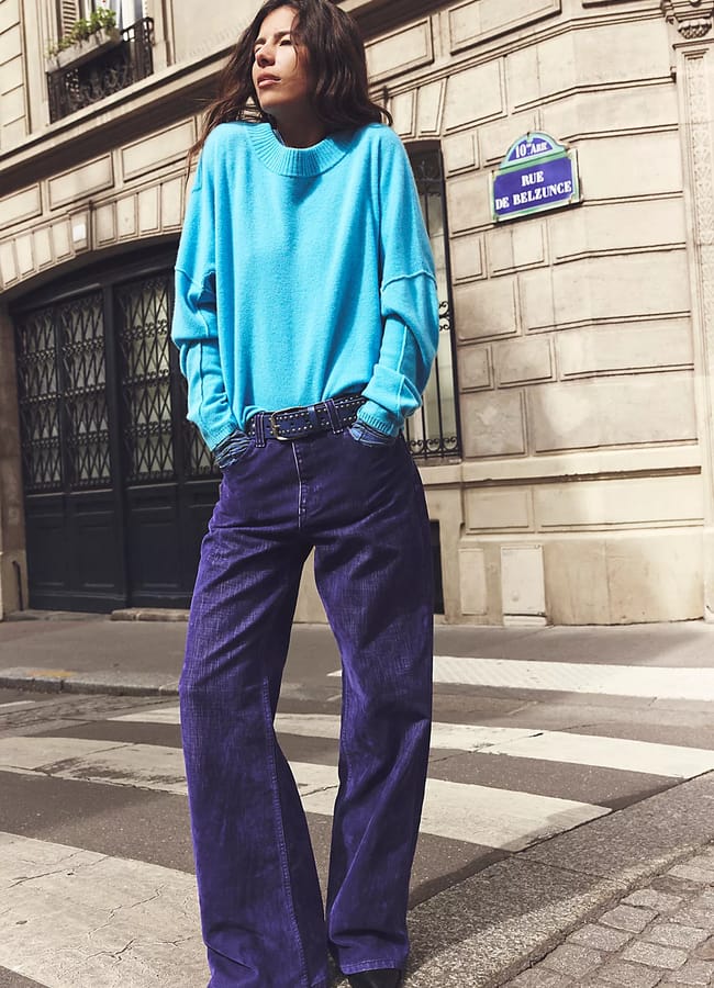 model wearing purple corduroy trousers