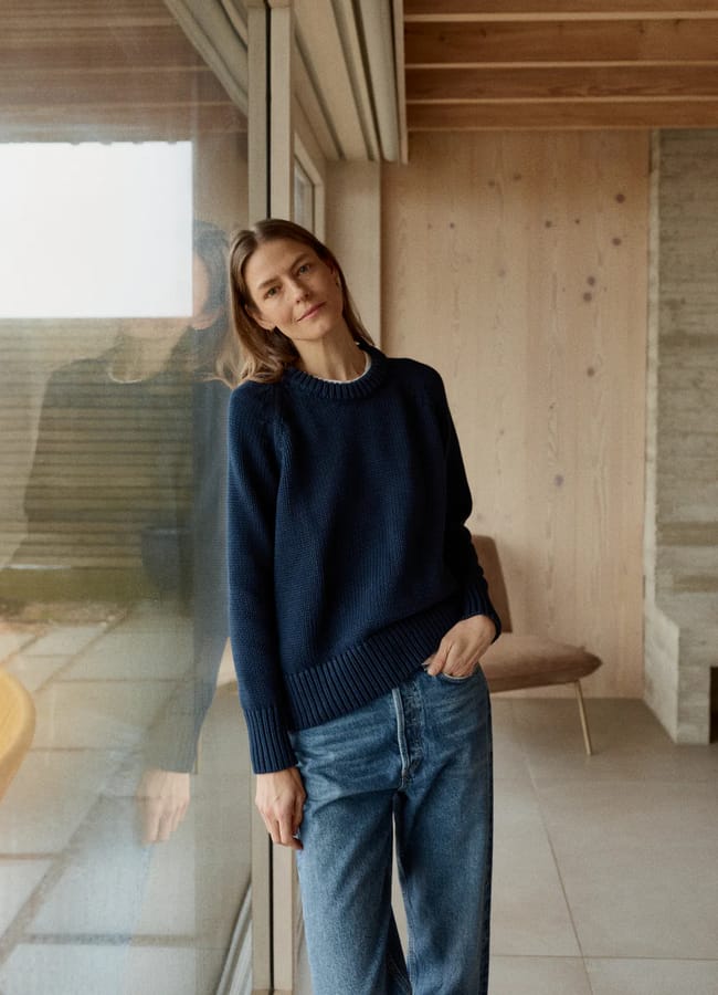 model wearing navy knit jumper