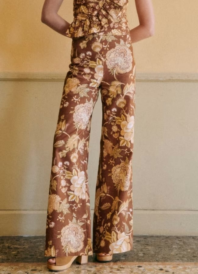 close up of model wearing floral trousers