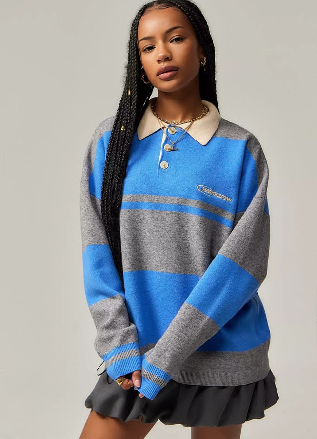 model wearing blue and grey stripe rugby top