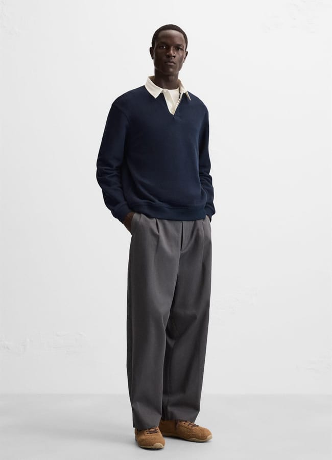 male model wearing ZARA POLO SHIRT WITH CONTRAST COLLAR and smart trousers