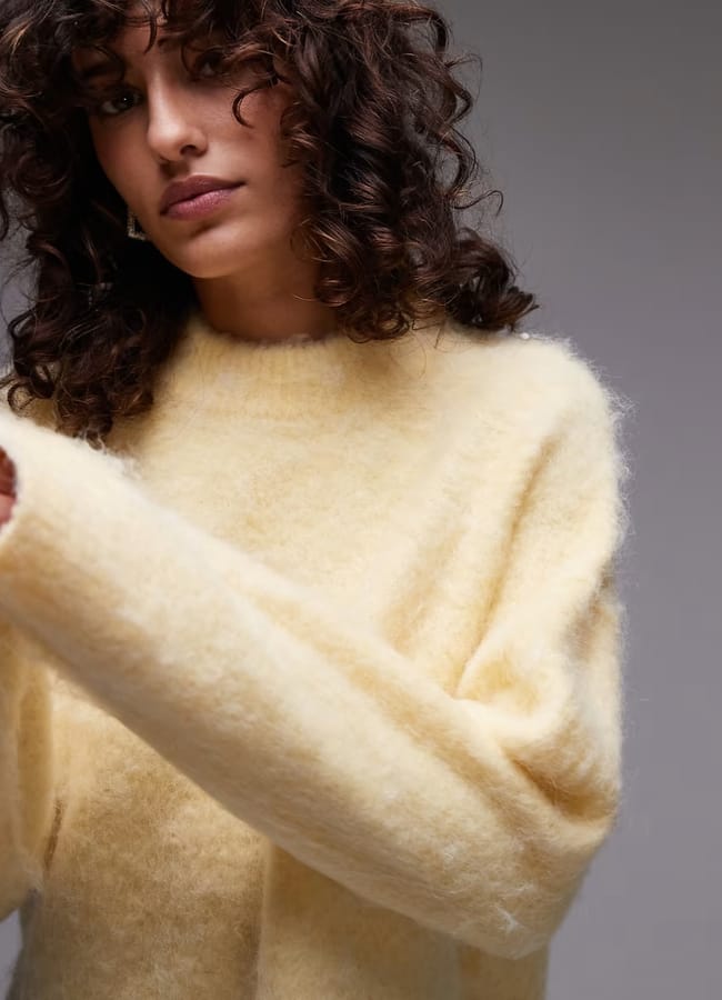 model wearing ASOS Topshop knitted fluffy relaxed jumper in buttermilk