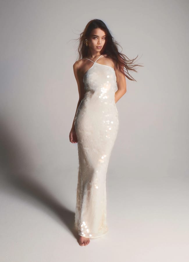 model in white sequin dress