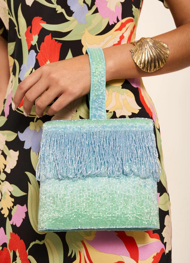 model holding RIXO Zenni Beaded Silk Bag