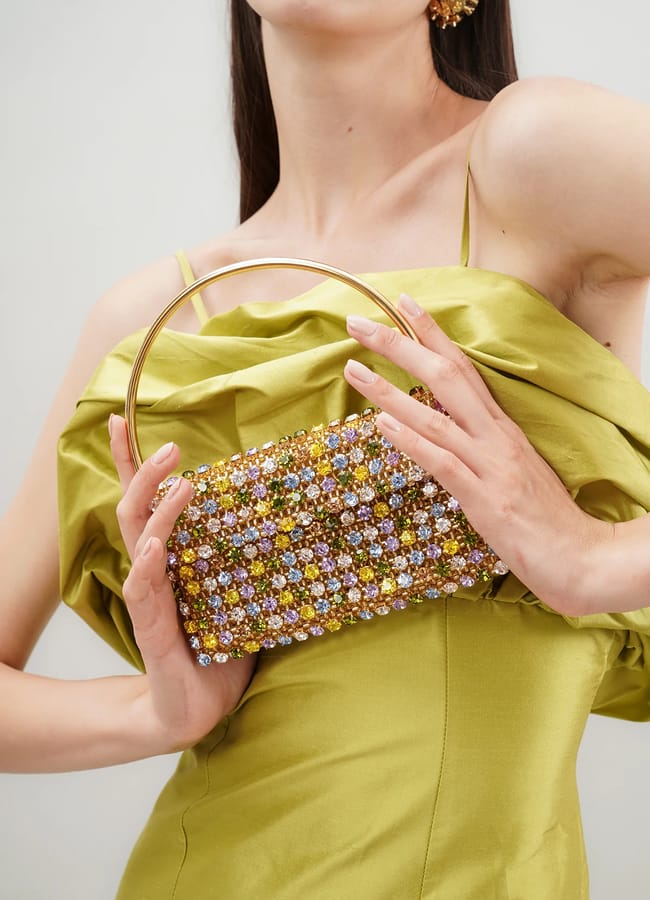 model holding gemstone bag