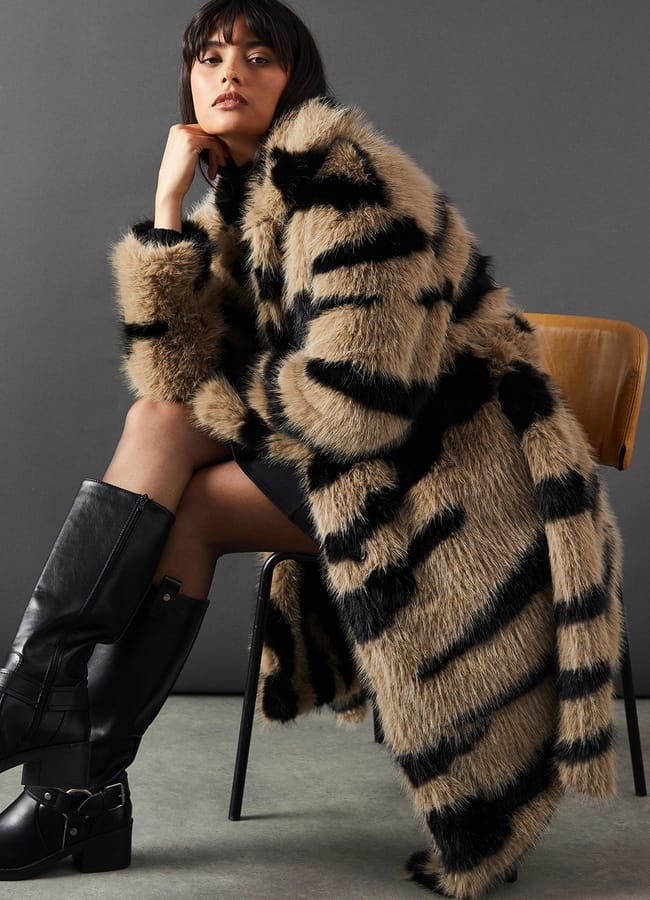 model wearing zebra print fur coat