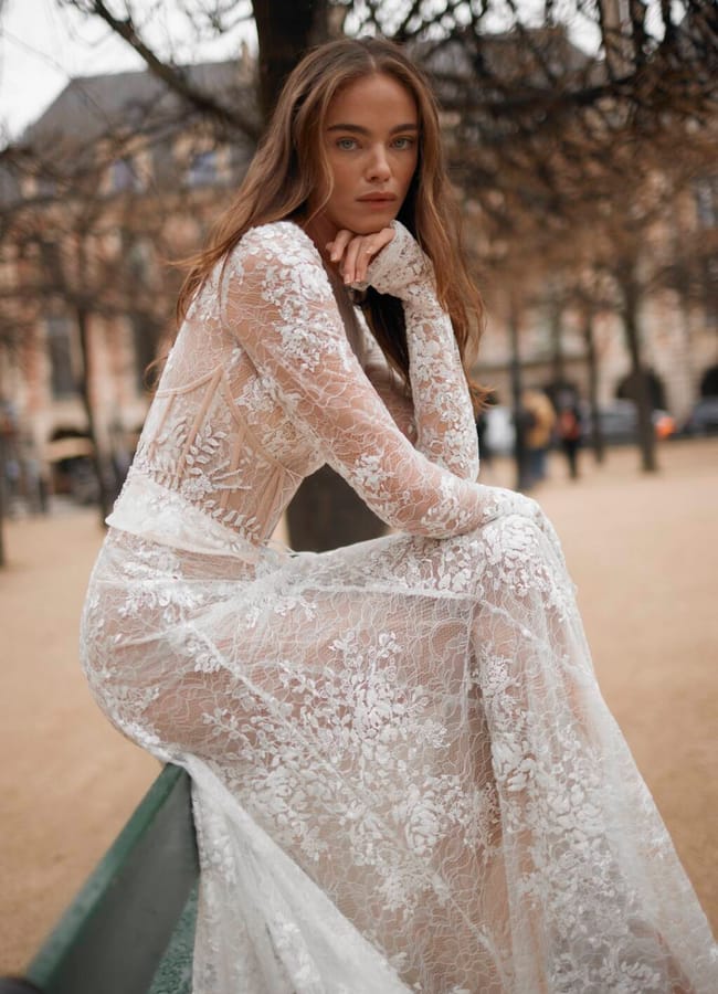model on bench in wedding gown