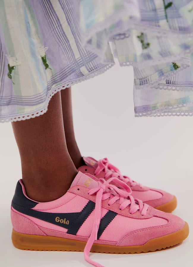 model's feet close up wearing pink Gola Tornado Trainers