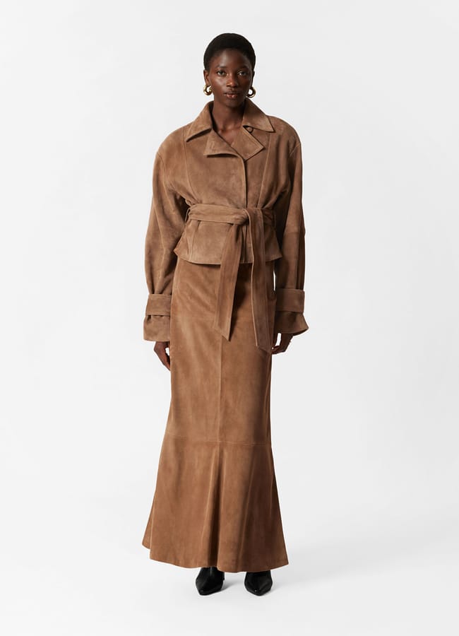 model wearing brown suede skirt and jacket