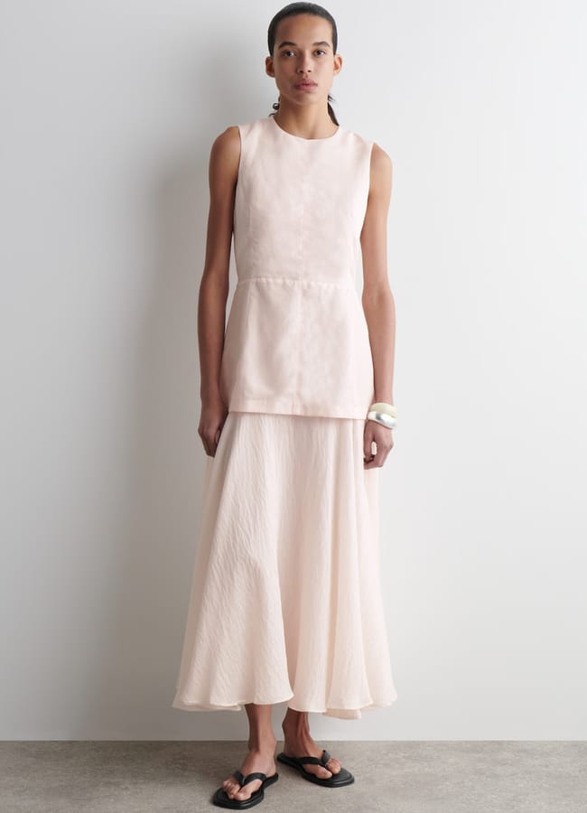 model wearing cos pink layered dress