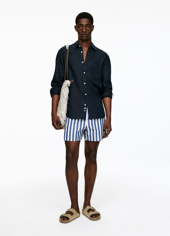 male model wearing shirt and arket Striped Swim Shorts