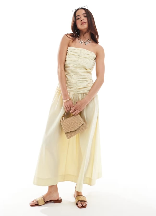 model wearing ASOS DESIGN full skirt off shoulder midi dress with ruched bodice in buttermilk