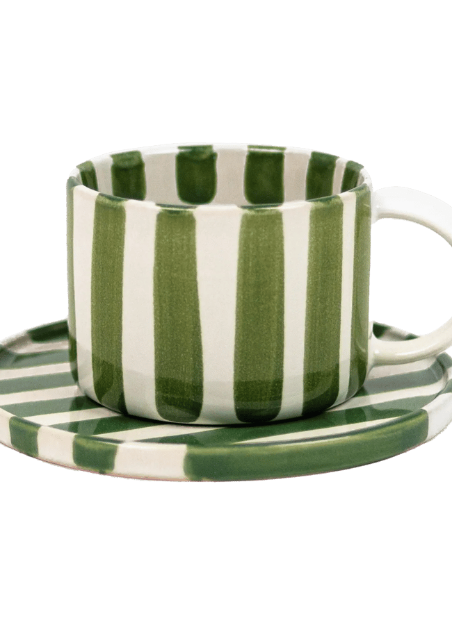 green and white cup and saucer