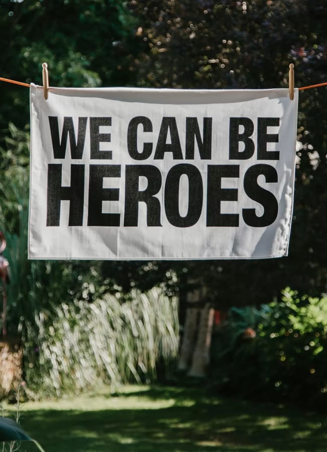 London Drying We Can Be Heroes Tea Towel hanging on washing line