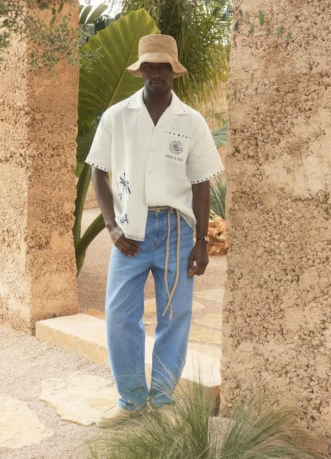 male model wearing embroidered white shirt