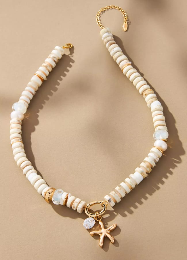 white beaded necklace with starfish charm