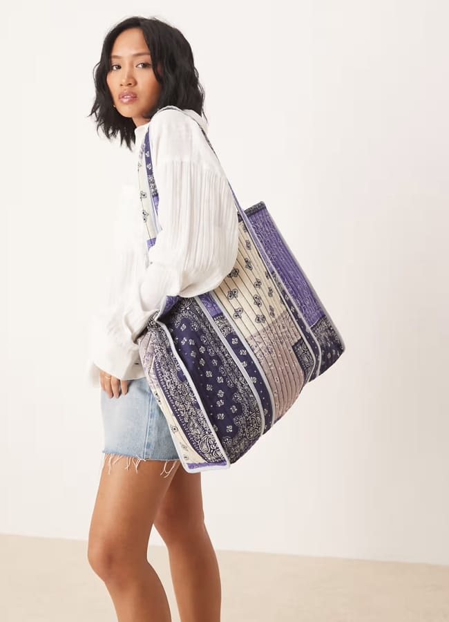 model with ASOS DESIGN quilted patchwork tote bag