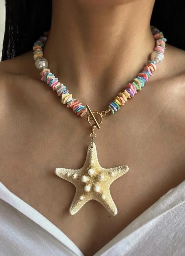 close up of model's chest wearing ETSY Mermaid Core Real Starfish Choker Necklace, Colorful Sea Shell