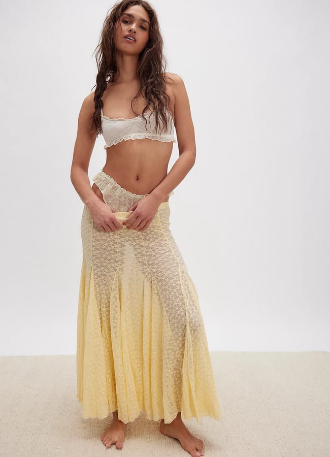 model wearing Free Peop;le Kiss Kiss Half Slip in yellow