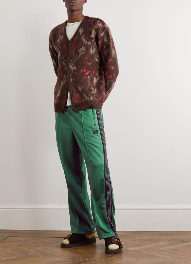 male model wearing green track pants and brown cardigan