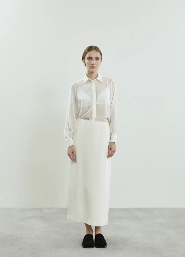 model wearing sheer shirt and Alvida skirt