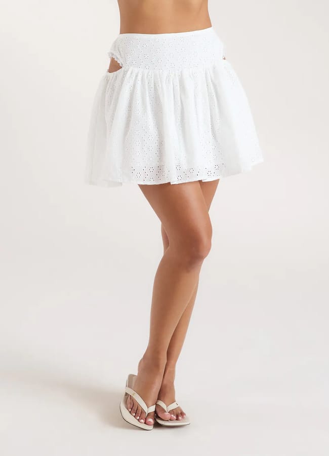 close up of model wearing white Broderie Mini Skirt