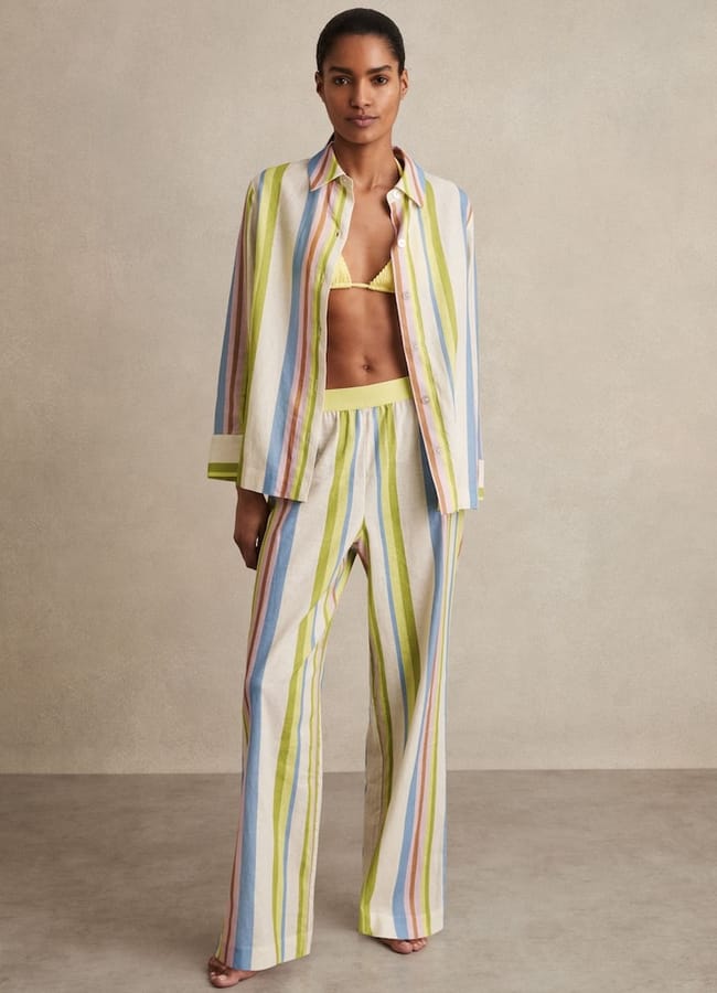 model wearing striped shirt and trousers set