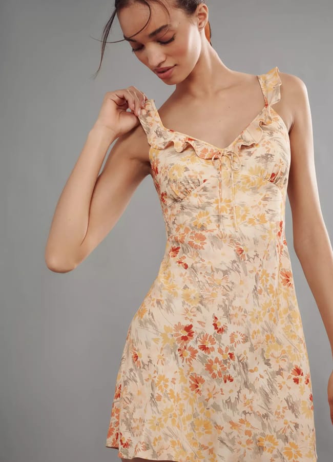 model wearing Faithfull Sleeveless Ruffle Mini Dress